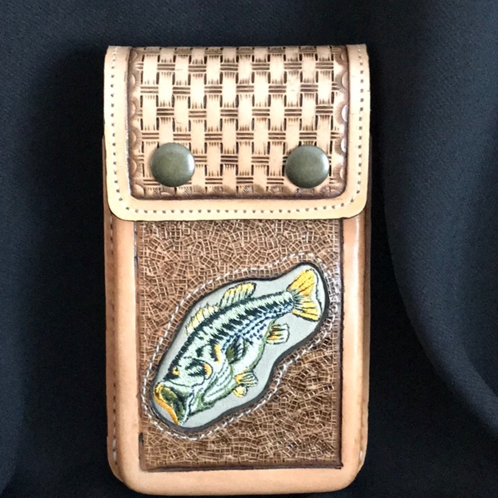 Handmade all leather cell phone carrier.